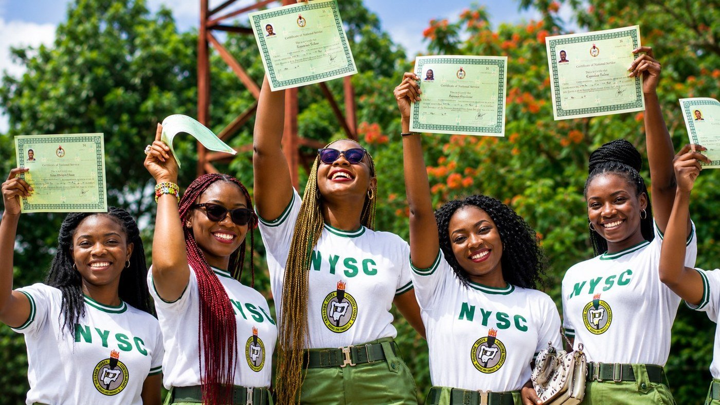 NYSC corps members celebrating their certificates